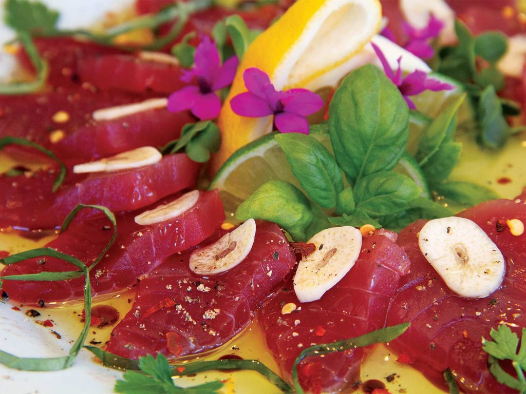 A plate of raw tuna sashimi.