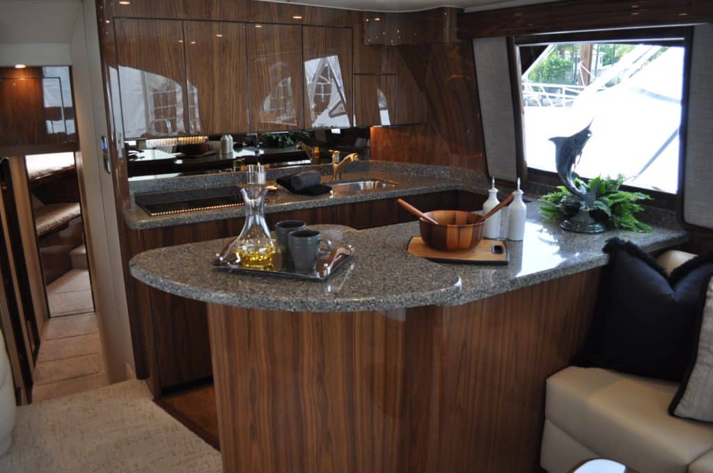 The interior is spacious, warm and inviting. This boat was outfitted in sleek gloss walnut wood.