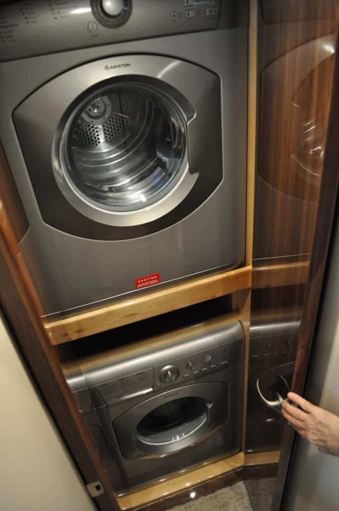 An enclosed cabinet to port just down the stairs houses a washer and dryer, a great option on a 48-footer.