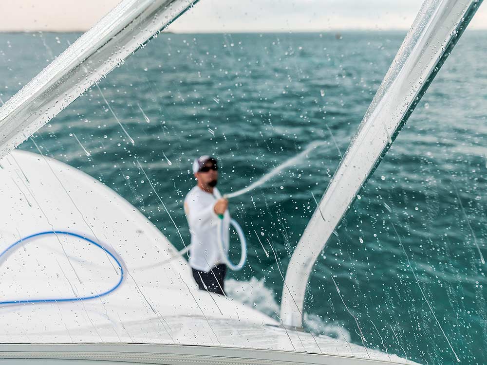 crewman washing the boat