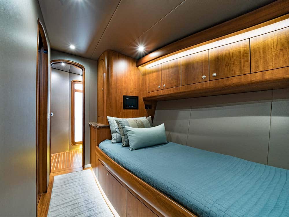 a bedroom in the willis 77 uno mas yacht