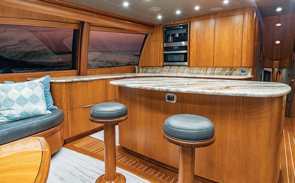 the kitchen and living area of the willis 77 yacht