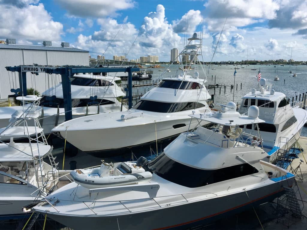Several sport fishing boats in dry dock at Viking Yacht Company.