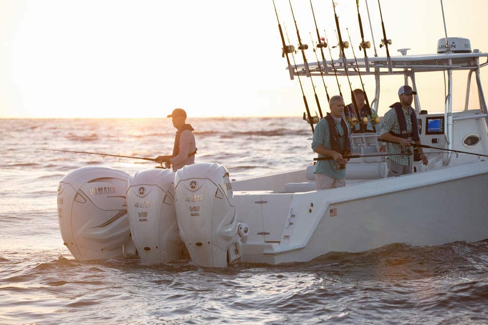 four men on a fishing boat with yamaha outboard engine