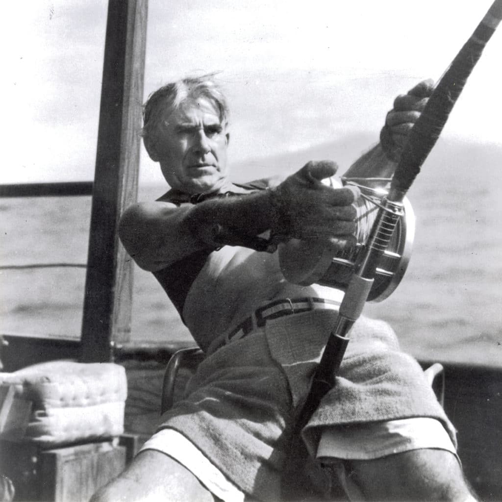 Black and white image of Zane Grey fishing.