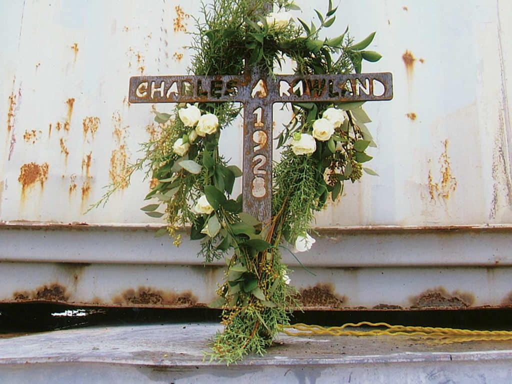 A metal cross welded to the artificial reef.