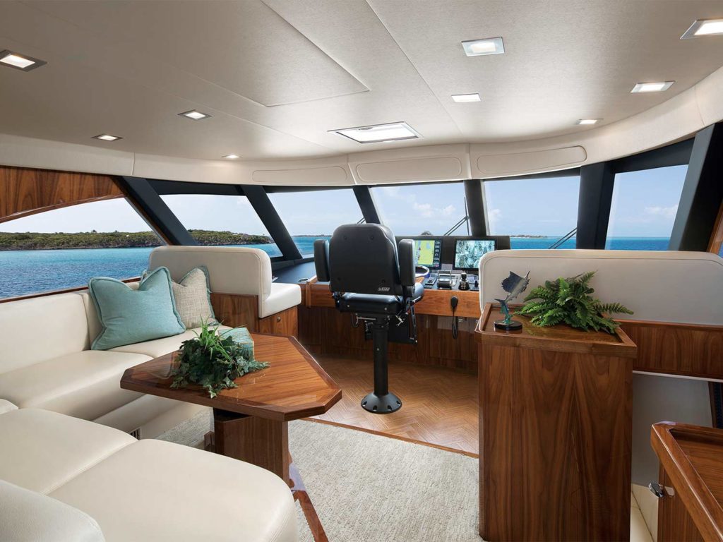 The interior enclosed helm of a sport-fishing boat.