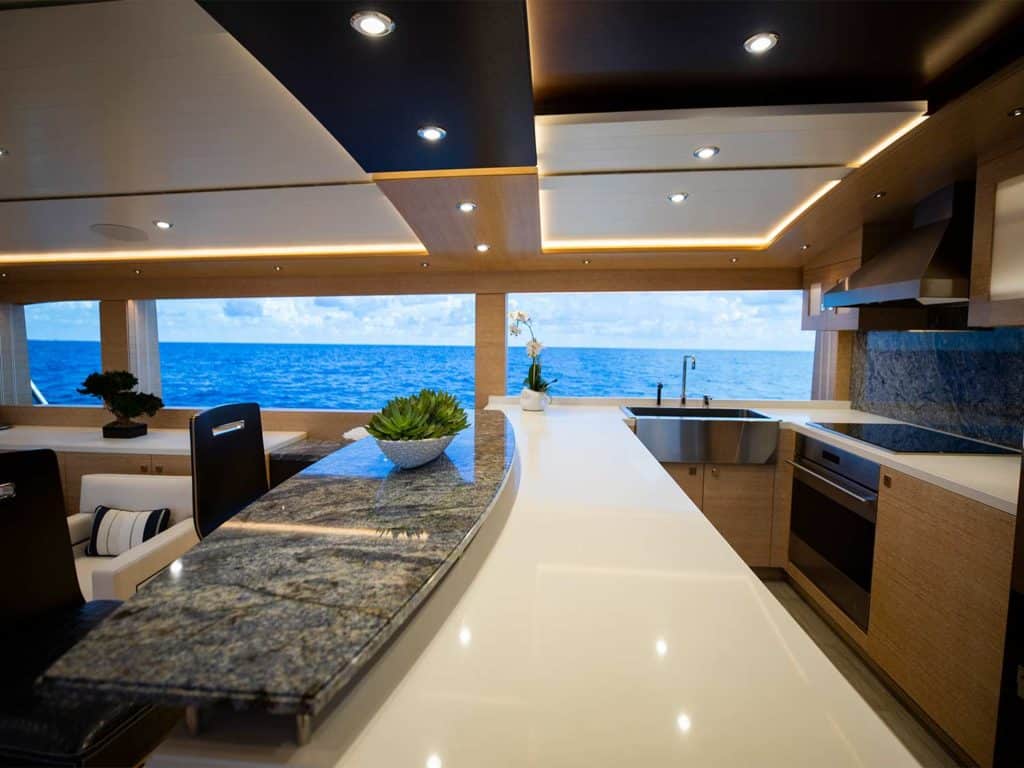 The galley of the Michael Rybovich & Sons 94 sport-fishing boat with a view of the ocean.