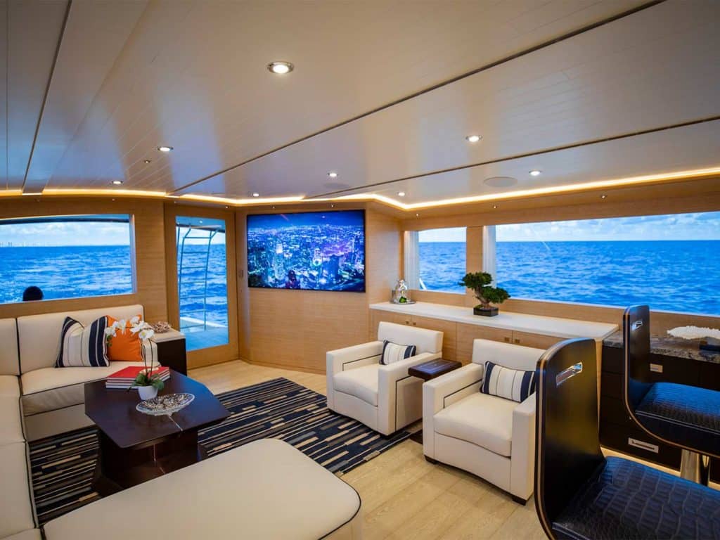 The interior salon of the Michael Rybovich & Sons 94 sport-fishing boat with full view of the ocean.