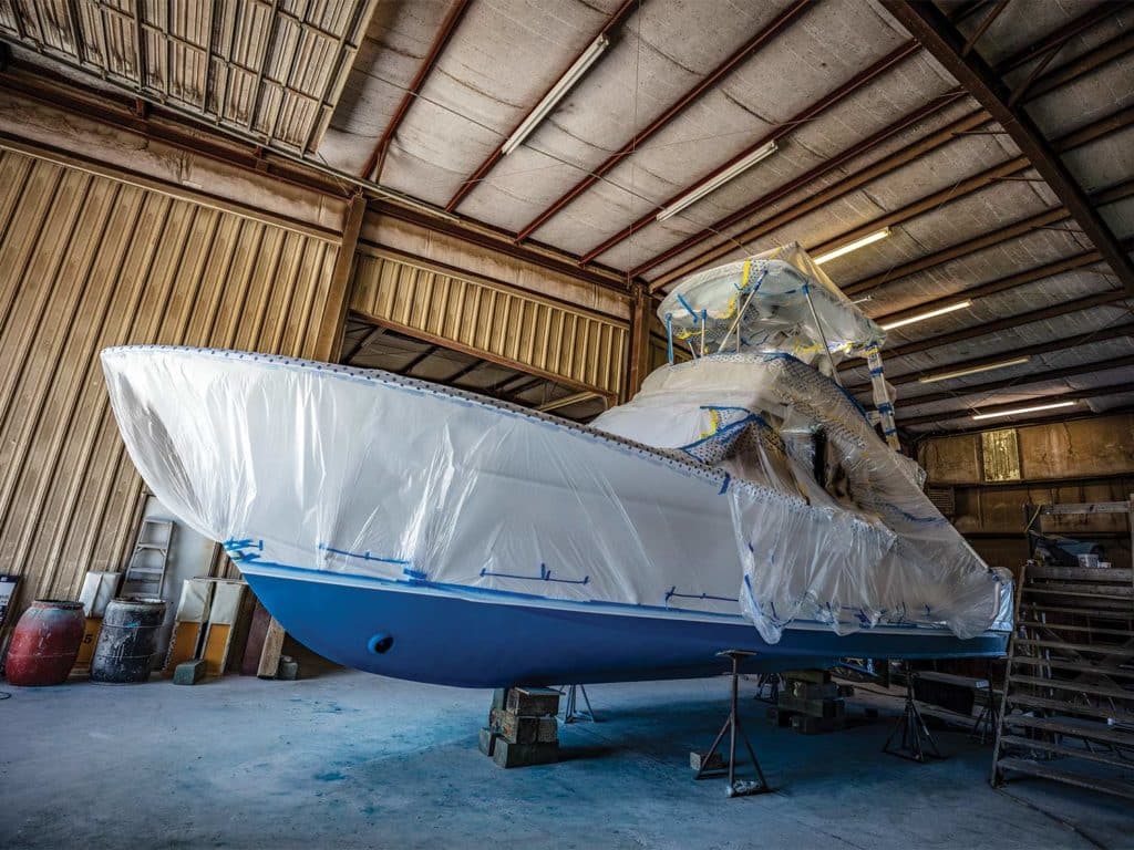 A sport-fishing boat in drydock, ready for renovations.