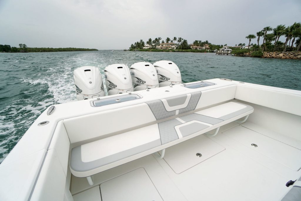 Four outboard boat motors on a fishing boat.