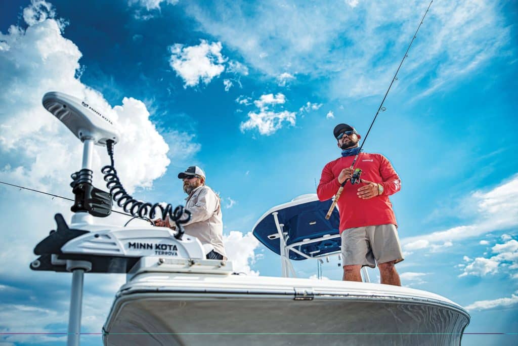 Two anglers on a fishing boat.