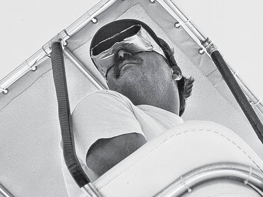 A boat captain standing in the boat tower.