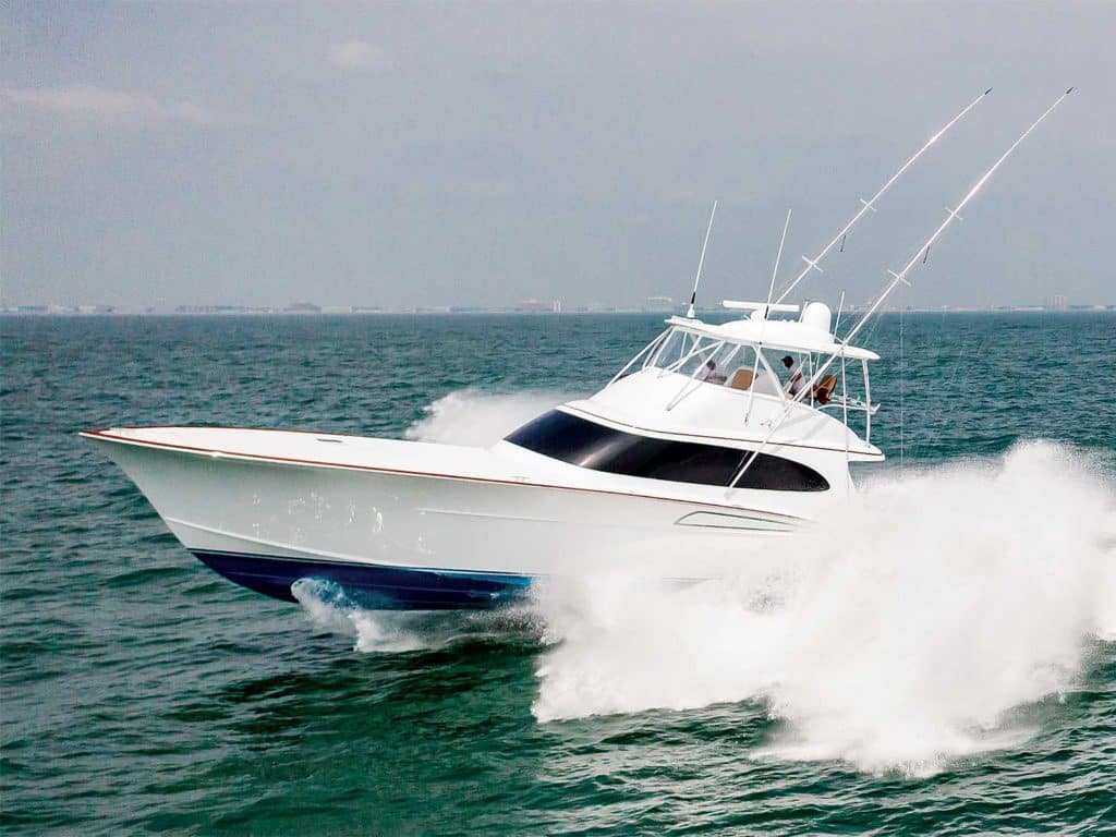 The Duffie Boatworks 64 making waves as it glides across the water.