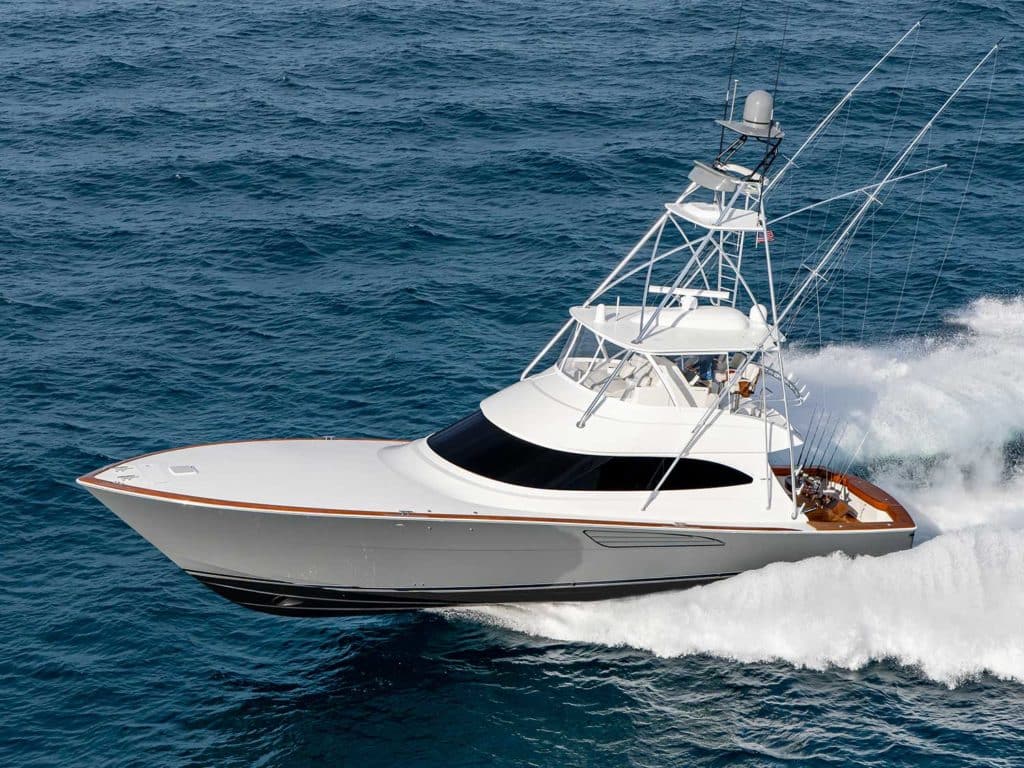 The Viking Yachts 64 sport-fishing boat making waves on the water.