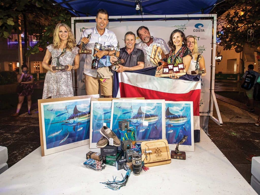 A group of winners celebrating victory at the Offshore World Championship.