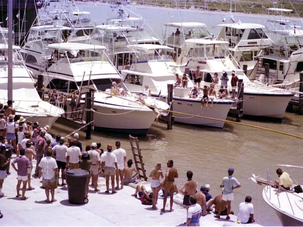 A group of people on the docks.