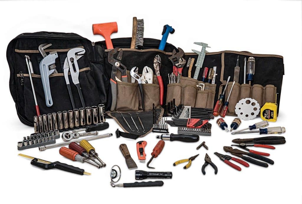 A tool bag full of a variety of repair tools.