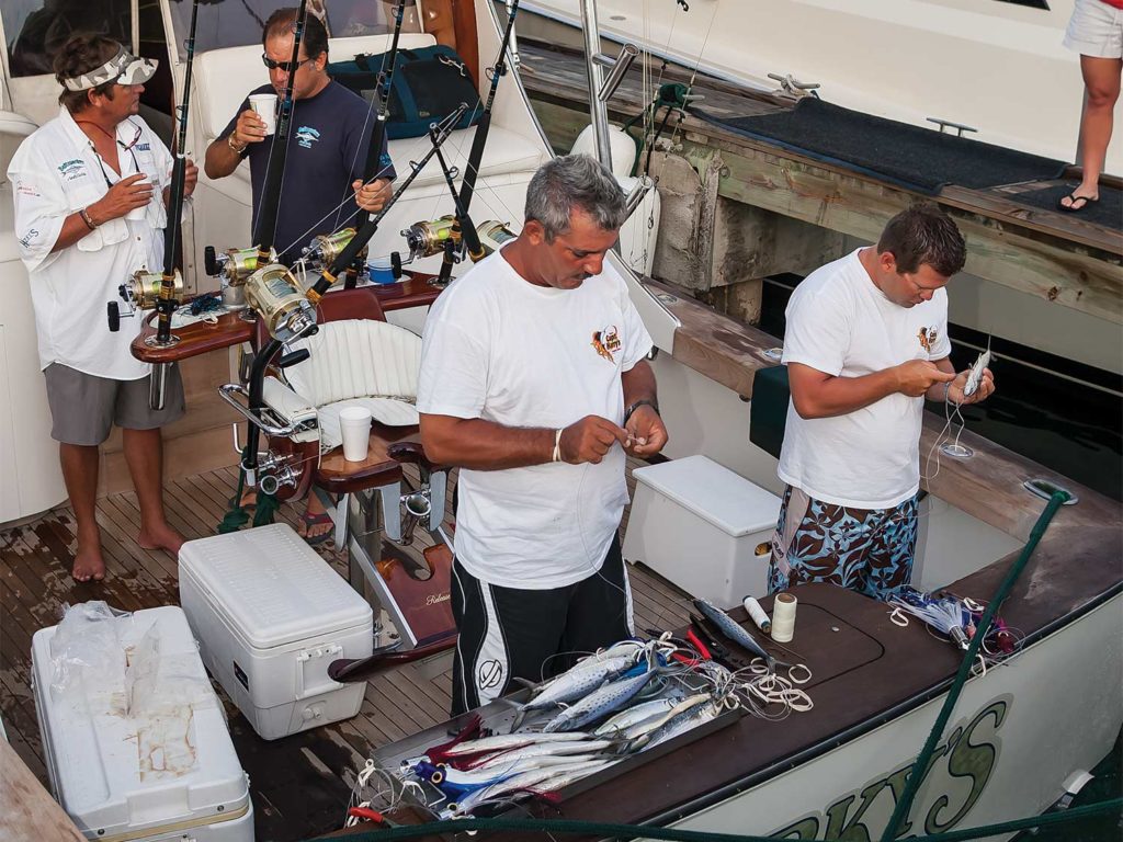 A fishing team on the deck of a boat.