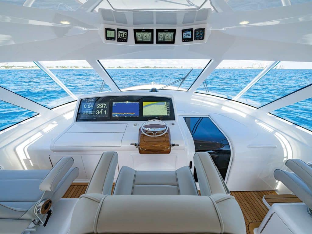 A view of the ocean and helm control panels of the Viking Yacht 54 Sport Tower
