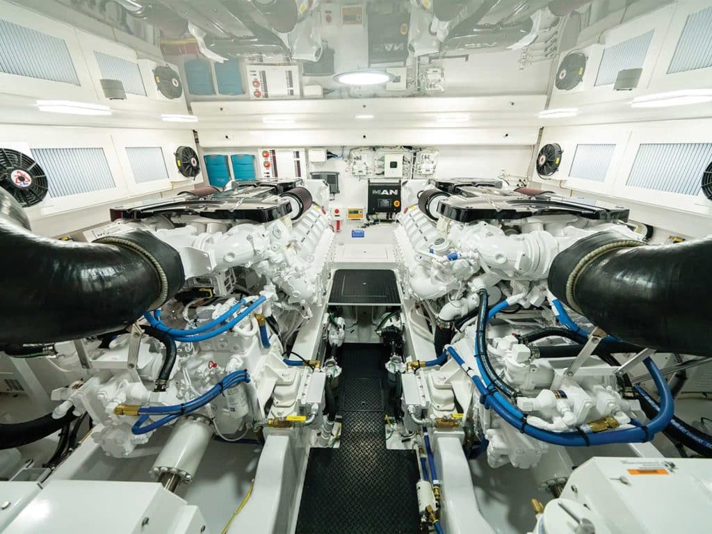 The stark white and clean engine room of the Viking Yacht 54 Sport Tower.