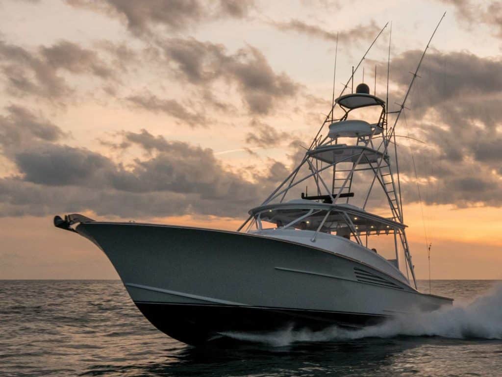 winter Custom Yachts 53 Express on the ocean at sunset.