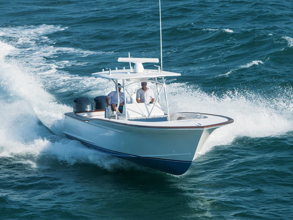 A Jarrett Bay Boatworks sport-fishing boat cruising across the water.