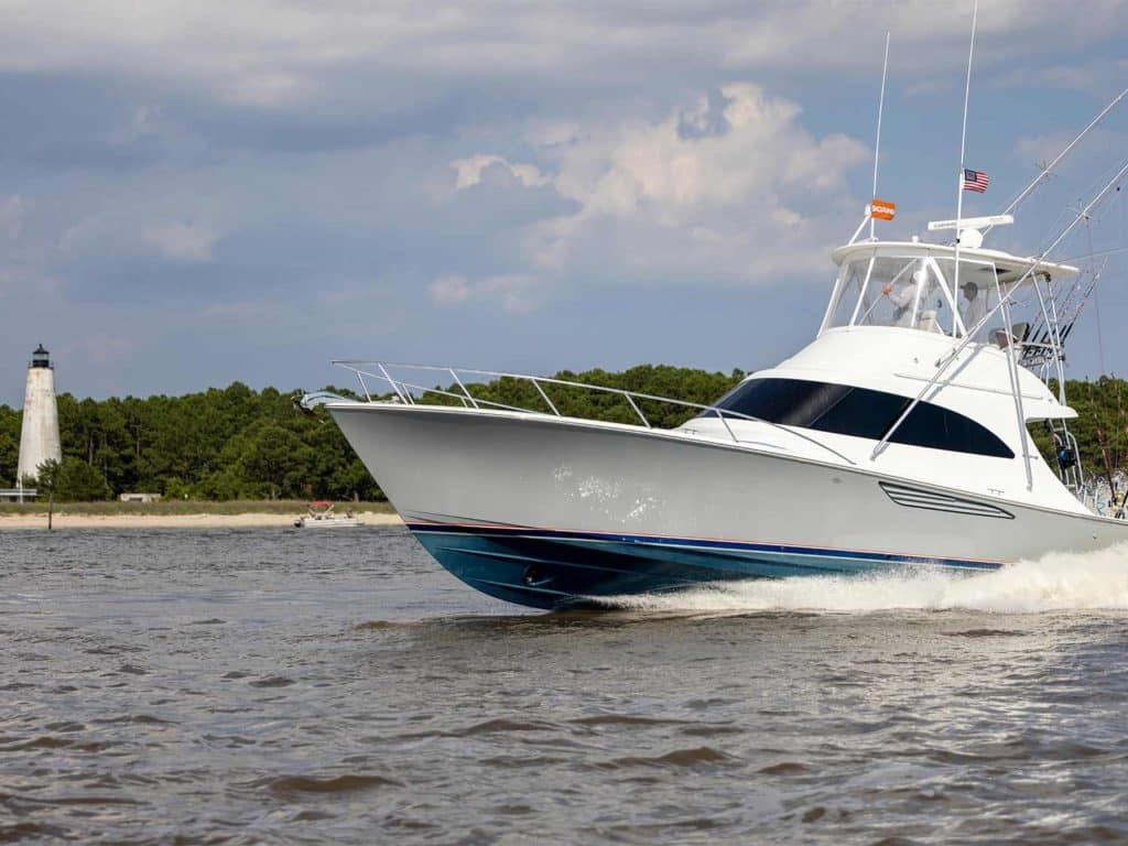 A sport-fishing boat cruising across the water.