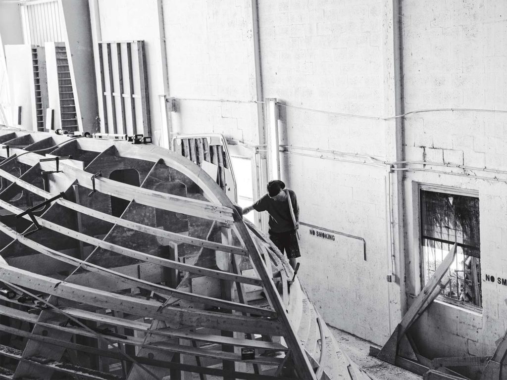 A black and white image of the support structure of a custom boat build.