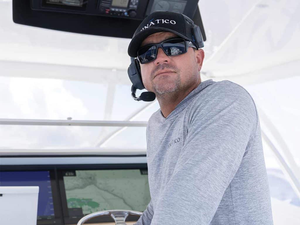 Captain Cory Gillespie at the helm of a Titan Custom Yacht.