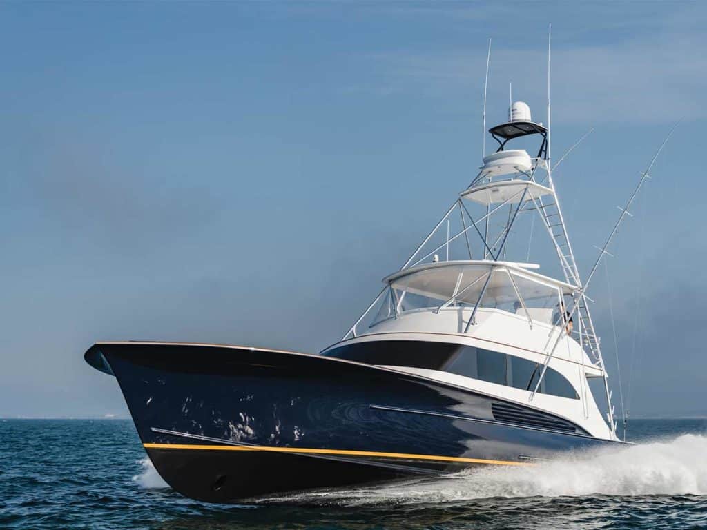 A sport-fishing boat cruises across the water.