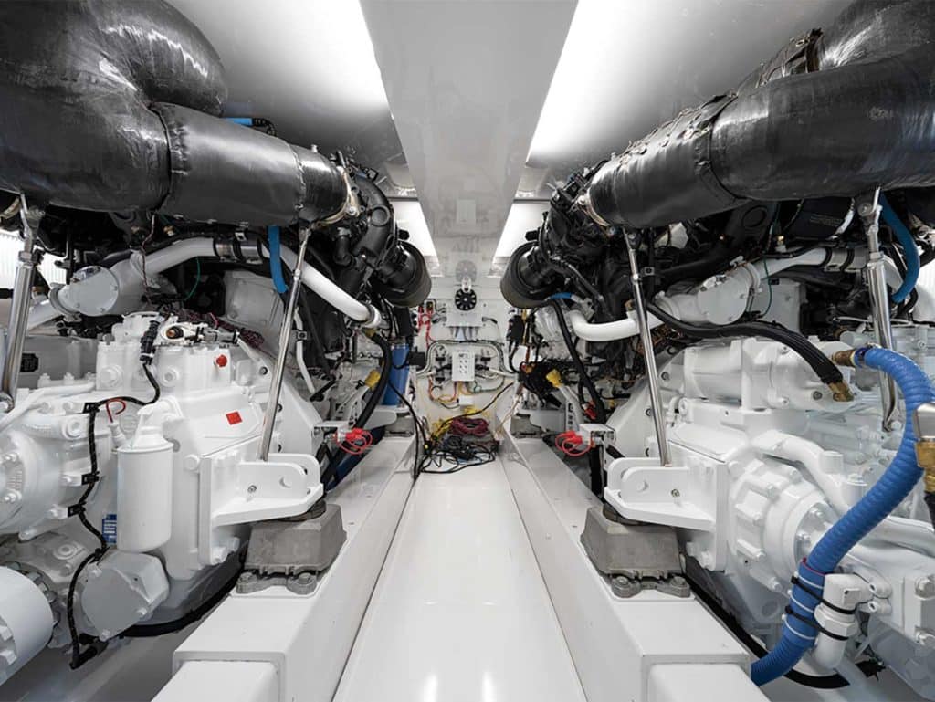 The stark white interior of a sport-fishing boat engine.