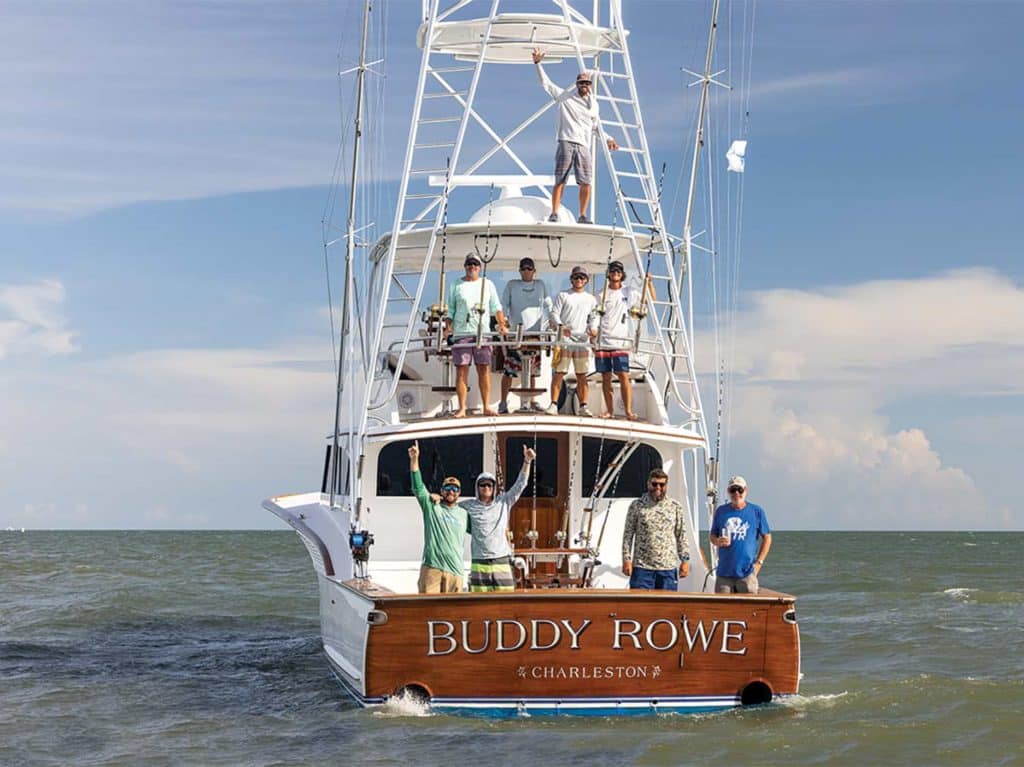 A sport-fishing boat cruises across the water.