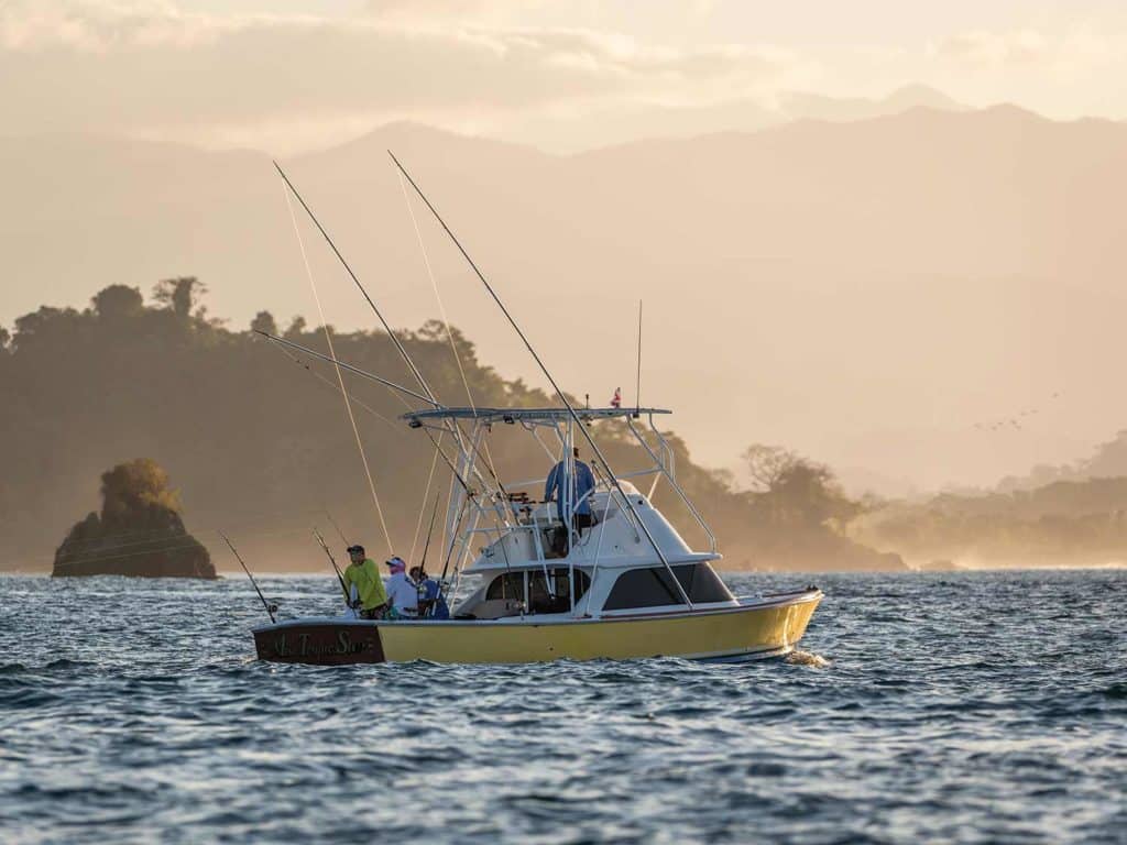 A sport-fishing boat across the water.