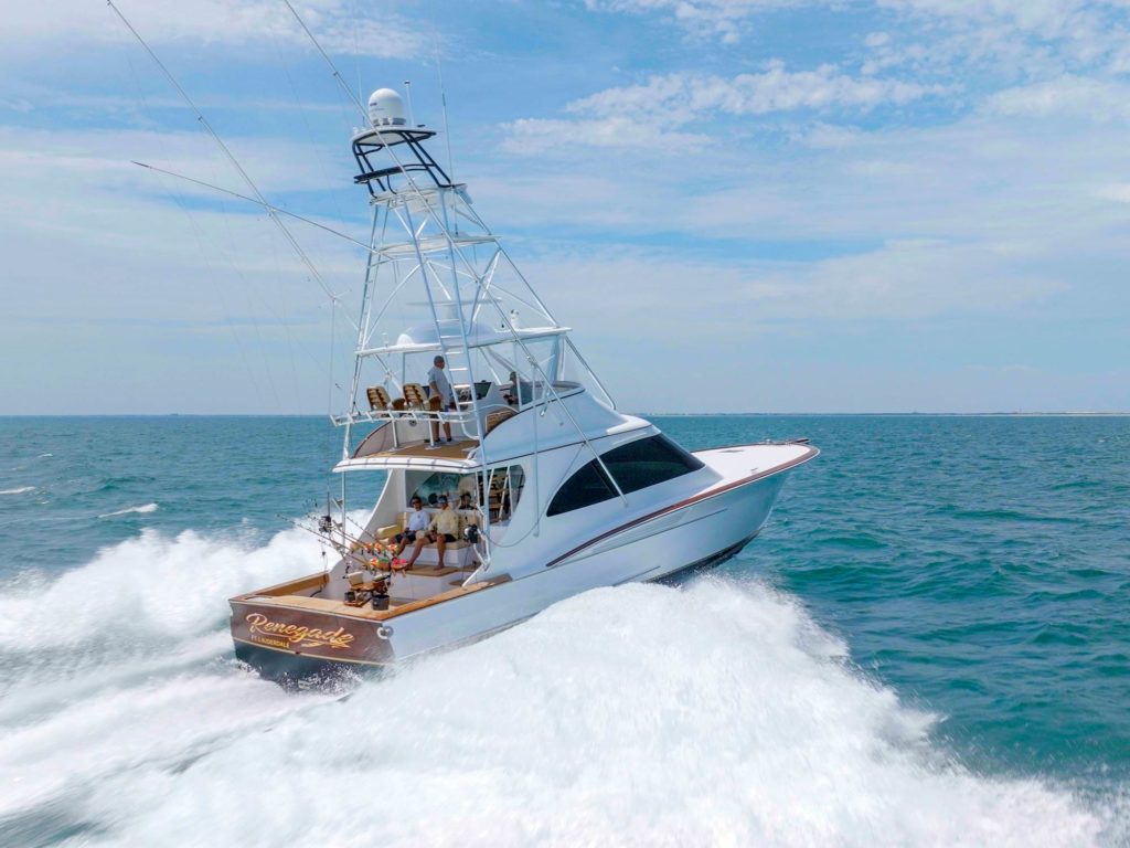 A sport-fishing boat cruising across the water.