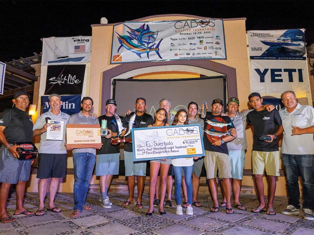 A sport-fishing team celebrating at an awards show.