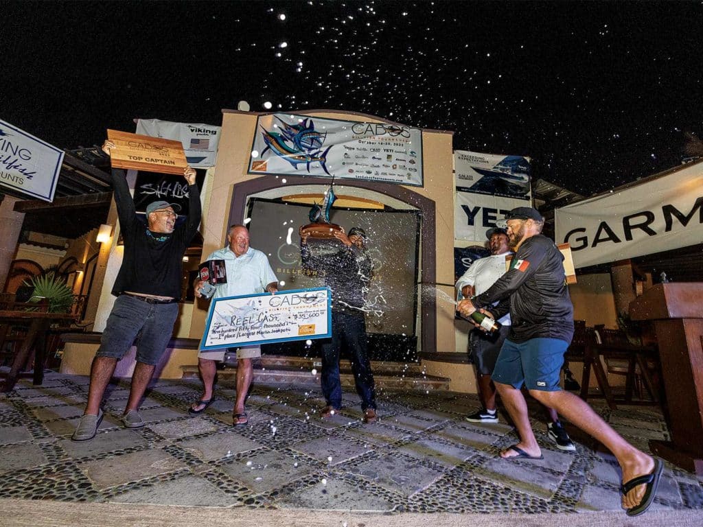 A sport-fishing team celebrating at an awards show.