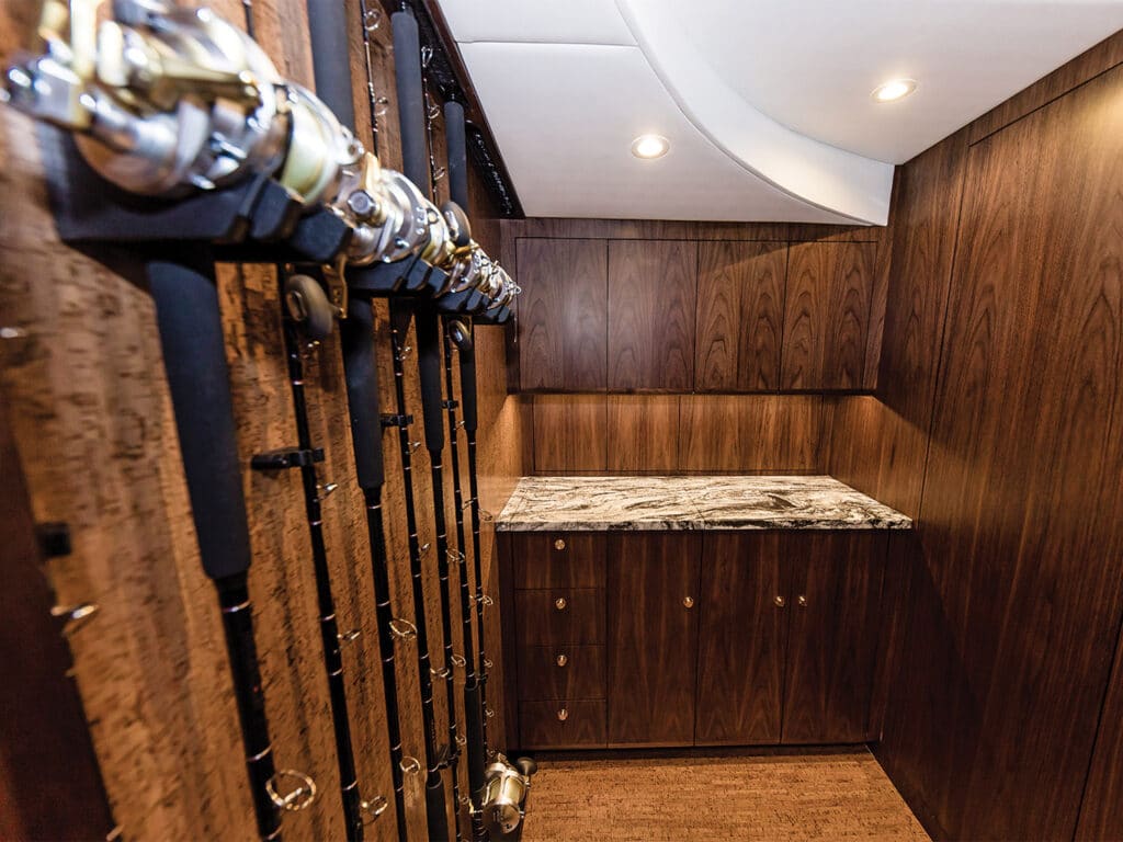 The interior wood-finished storage spaces of the custom Bayliss Boatworks sport-fishing boat.