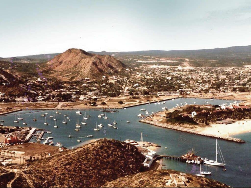 An old aerial photograph of the Los Cabos marina being dredged in the early stages of construction.