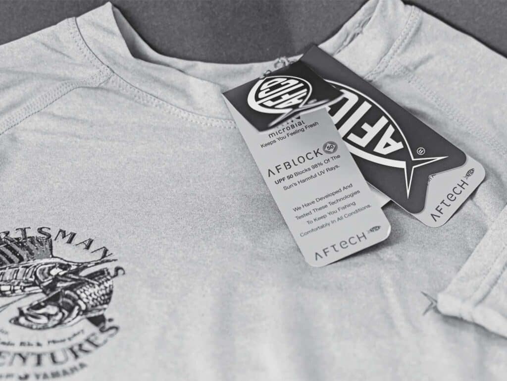 A black and white image of an AFTCO tshirt.