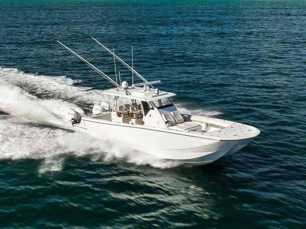 A small outboard Barker Boatworks sport-fishing boat cruises across the open ocean.