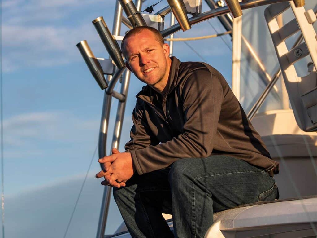 Capt. Buddy Callaway sits atop Capt. BC's helm.