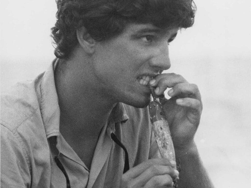 Black and white image of Capt Peter Wright working with a lure.