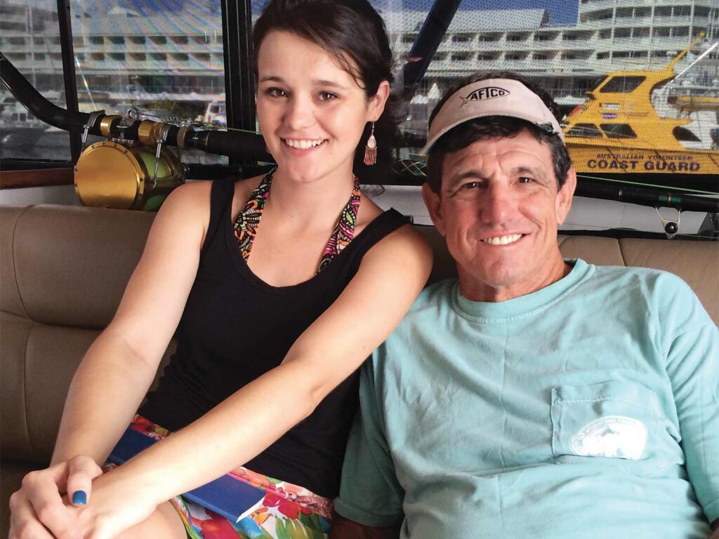 Capt. Peter Wright with his daughter on their boat in Cairns.