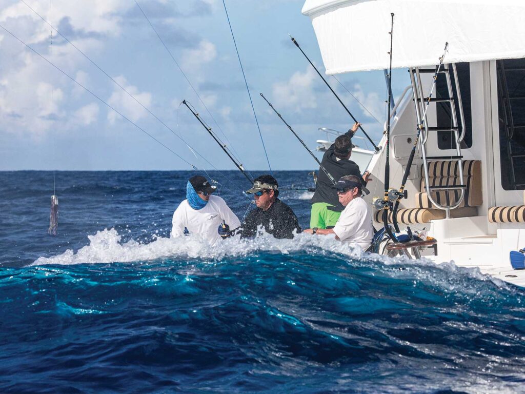 A sport-fishing crew working the cockpit using light tackle.