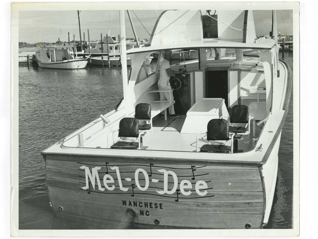 A black and white image of a boat deck transom and cockpit.