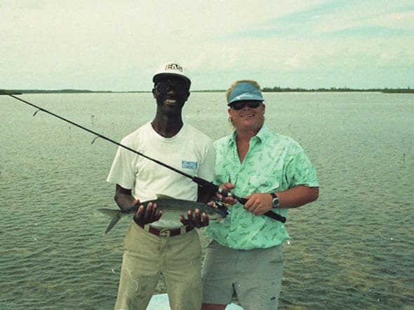 Karl Anderson standing next to a fellow angler.
