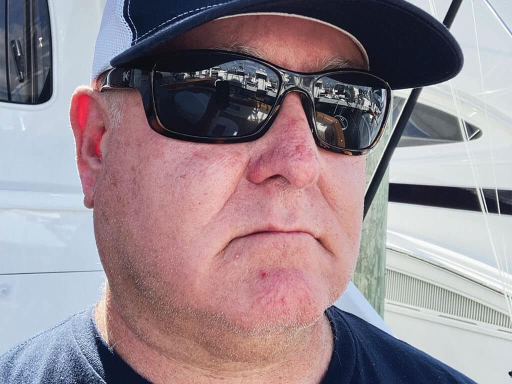 Portrat of Capt. Tucker Colquohoun wearing sunglasses and a cap.