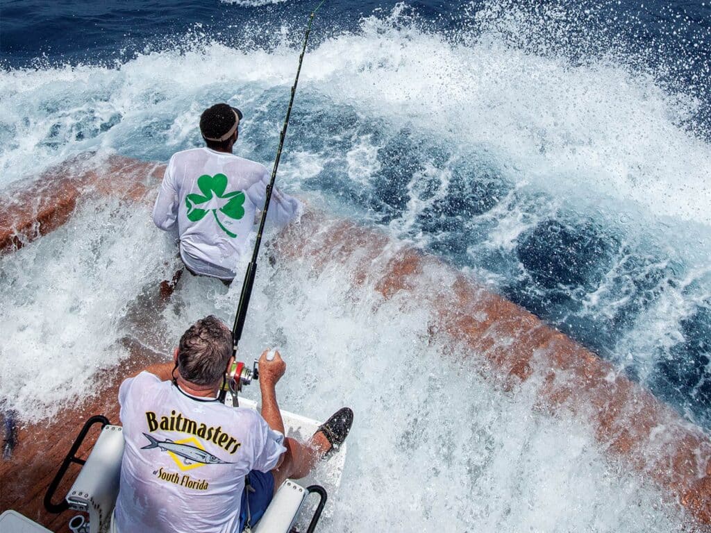 A sportfishing crew fishing in rough waters.