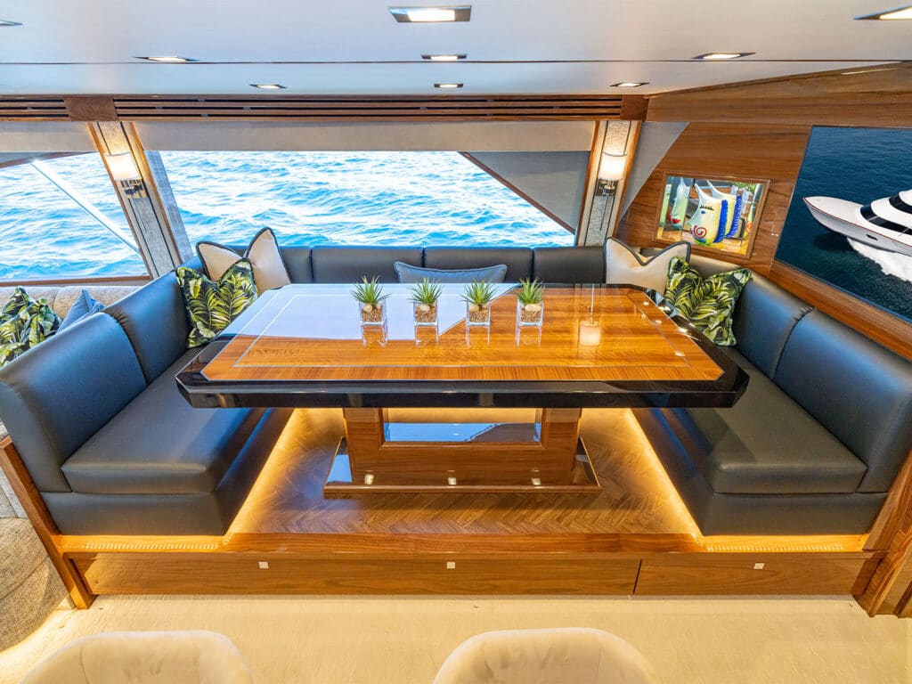 Interior dining and seating of the Viking Yacht 90 sport-fishing boat.